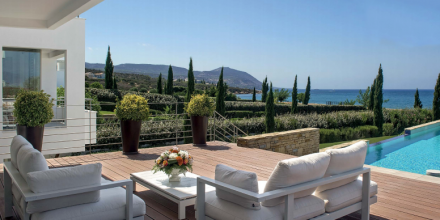 external view of villa and deck with garden on the background