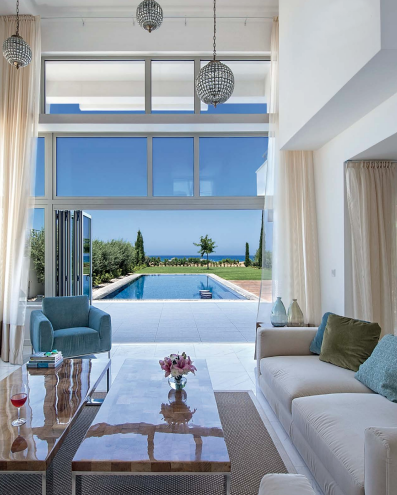 modern living room with balcony and pool view